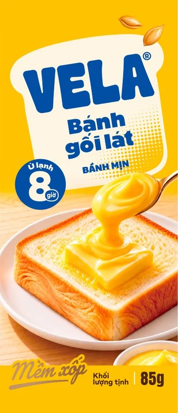 Mặt trước bao bì Bánh gối lát VELA vị bơ sữa, bao bì màu vàng